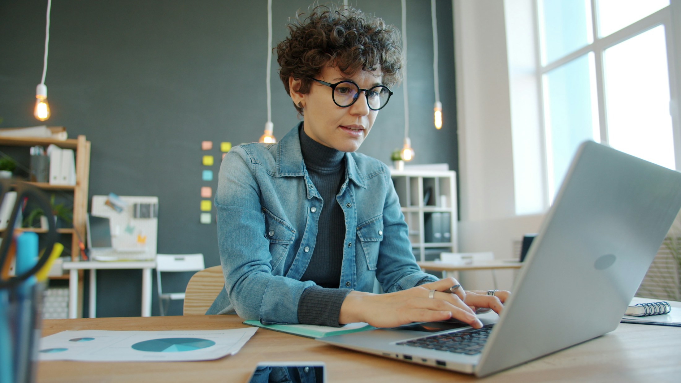 An entrepreneur working on her business in a modern office